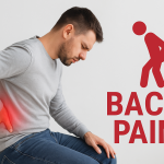 A young English man sitting and holding his painful back. back pain has been caused after long desk job postures , lifestyle and mobile usage. The man is young but feeling helpless due to backpain difficulty- Physiotherapy can help to cure such types of backpain.